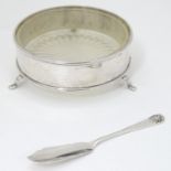 A silver butter dish with glass liner and silver knife, hallmarked Sheffield 1940 maker Robert