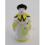 A Royal Worcester figural candle snuffer modelled as a Mandarin. Marked within. Approx. 3 3/4"