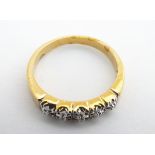 A gilt metal ring set with 5 chip set diamonds. Ring size approx. Q Please Note - we do not make