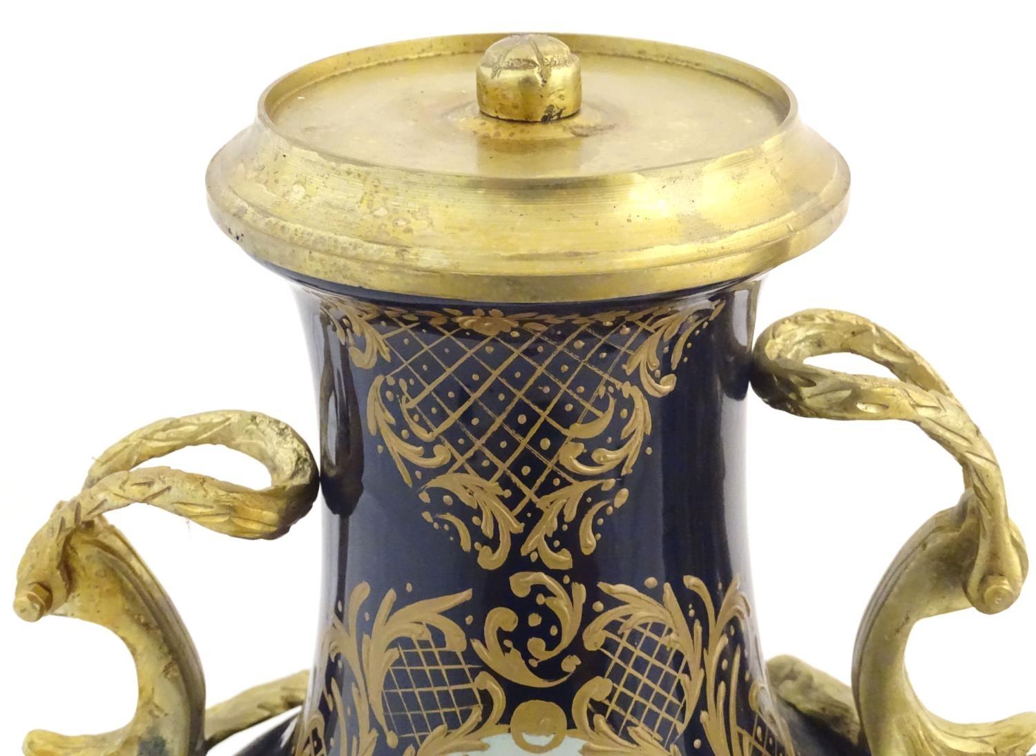 A matched pair of Sevres style lidded urn garnitures on mounted bases, with cobalt blue - Image 10 of 11