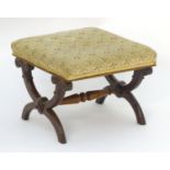 A late 19thC mahogany X-frame stool with a rectangular top, scrolled legs and a turned tapering