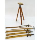 An 'Ensign' artist's folding portable easel, together with three tripods, a further folding tripod