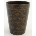 A 19thC Indian bronze and black enamel lassi cup / beaker with scrolling floral and foliate