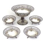 A silver table suite comprising silver fruit bowl of pedestal form with lattice work pierced rim