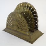 A Victorian two sectional brass letter rack, the dividers each shaped as a fan with floral and
