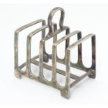 A silver four division toast rack. Hallmarked Sheffield 1936, maker James Dixon & Sons. Approx. 3?