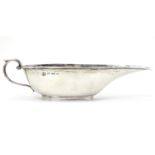 A small silver sauce boat of elongated form hallmarked Birmingham 1906 maker Aitken. 6" long