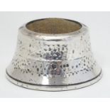 A silver pin cushion with hammered decoration. Hallmarked London 1918 maker J H Worrall, Son & Co