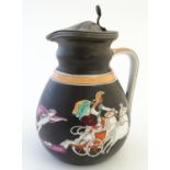 An English 19thC lidded jug, decorated with classical scenes on a black ground, depicting the combat