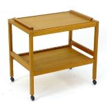 Vintage Retro: A teak Danish serving cart / trolley, stamped 'BL Moler, Made in Denmark'. Having a