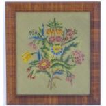 A late 19th / early 20thC needlework /embroidery / tapestry sample depicting flowers and foliage.