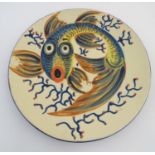 A Spanish Puigdemont majolica slipware plate / charger with fish and coral decoration. Signed under.