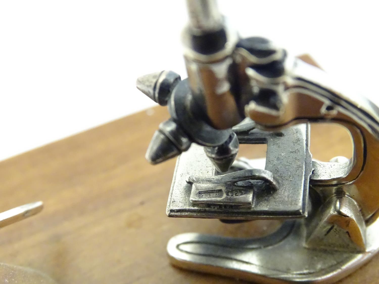 A Continental .925 silver miniature model of a microscope etc. mounted on a wooden base. Approx. - Image 2 of 8