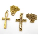 Two 9ct gold pendants of cross / crucifix form. The tallest approx 1 1/4" long. Together with