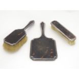 Three silver and tortoiseshell backed dressing table brushes. Hallmarked London 1927 maker Richard