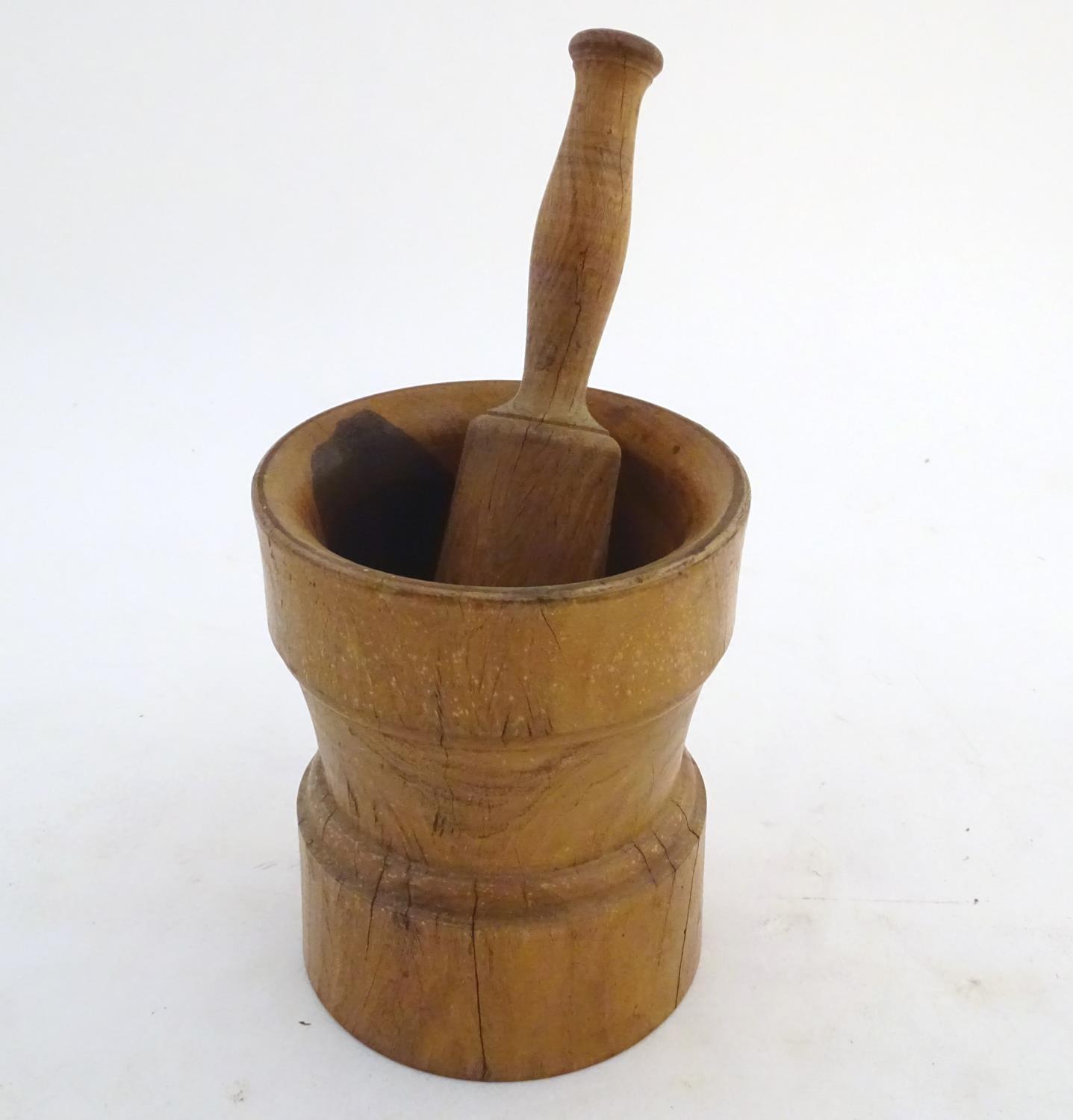 Kitchenalia: a continental 19thC Treen turned elm pestle and mortar, measuring 9 3/4" and 6 3/4" - Image 3 of 5