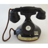 A novelty advertising decanter for Jim Beam bourbon whiskey, formed as a '1928 French phone',