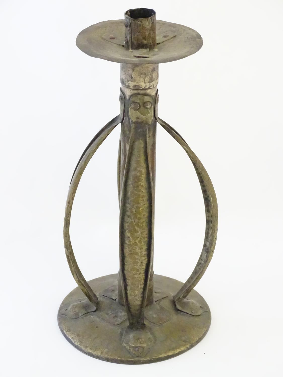 An Arts and Crafts copper and brass candlestick with a hammered finish and bowed strapwork supports, - Image 3 of 9