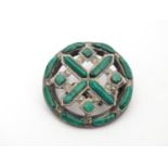 A late 19thC / early 20thC Scottish brooch of oval form set with malachite detail. White metal (