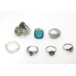 7 assorted silver and white metal dress rings. Please Note - we do not make reference to the