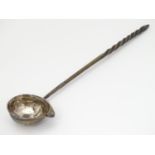 A Geo II toddy ladle with with white metal bowl inset with coin. The whole approx. 12 3/4" long.