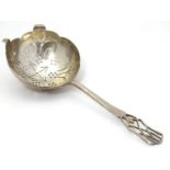 An Art Deco silver tea strainer, hallmarked Sheffield 1937, maker Viners Ltd. Approx. 6" long Please