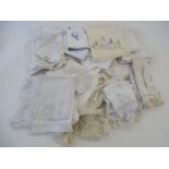 A quantity of assorted lace and fabric samples, to include doilies, embroidered table runners etc.