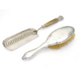 A silver backed brush hallmarked Chester 1914 together with a silver plate crumb scoop with antler