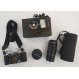 A mid-20thC film camera photographic kit, comprising Prinzflex SLR camera, super-Takuma telephoto