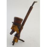 An early 20thC Bavarian/Black Forest novelty figural smoking pipe, of sectional carved and turned