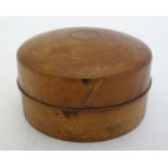 Treen: A 19thC turned wooden pot and cover of circular form, the cover with cork lining. Approx. 2