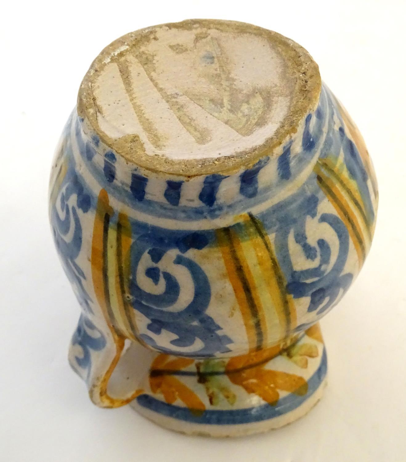 A 19thC Continental faience / tin glaze jug with a pinch spout, decorated with a roundel inscribed - Image 9 of 10