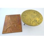 An early-20thC brass trivet, with naive decoration depicting three lions, together with a copper