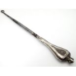 A silver handled button hook, hallmarked Chester 1909. Approx. 8 1/2" long Please Note - we do not