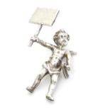 A white metal menu / table place card holder formed as a cherub. Approx 1 1/2" high Please Note - we