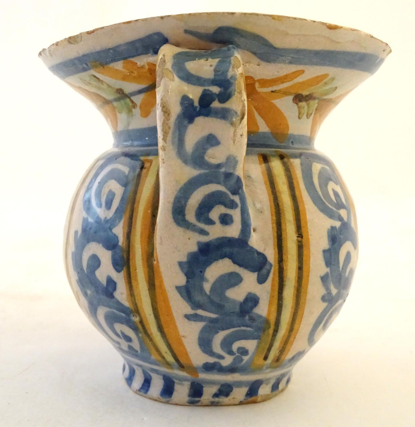 A 19thC Continental faience / tin glaze jug with a pinch spout, decorated with a roundel inscribed - Image 5 of 10