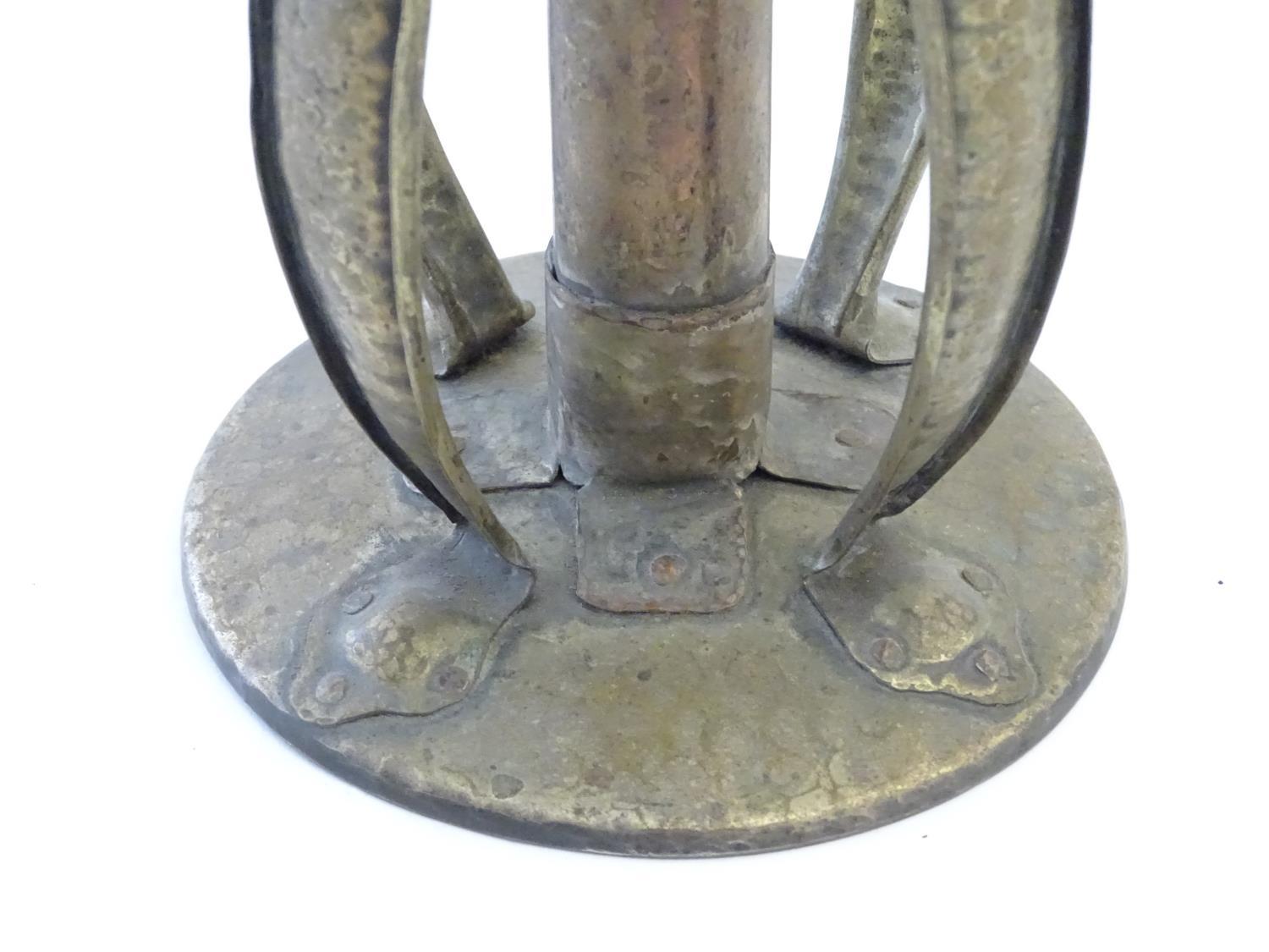 An Arts and Crafts copper and brass candlestick with a hammered finish and bowed strapwork supports, - Image 6 of 9