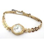 A Rotary 9ct gold cased ladies' wristwatch, fitted with a 9ct gold strap. With Rotary watch case.