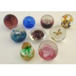 Glass: a collection of Victorian and later art glass paperweights, comprising three examples by