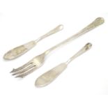 A pair of Hanoverian silver butter knives, together with a pickle fork. Hallmarked Sheffield 1965,