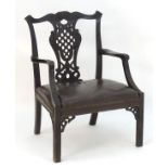 An Irish 19thC mahogany Chinese Chippendale open armchair with carved frame and pierced back