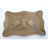 An early 20thC rectangular copper pin dish with a lobed rim and embossed Art Nouveau decoration.