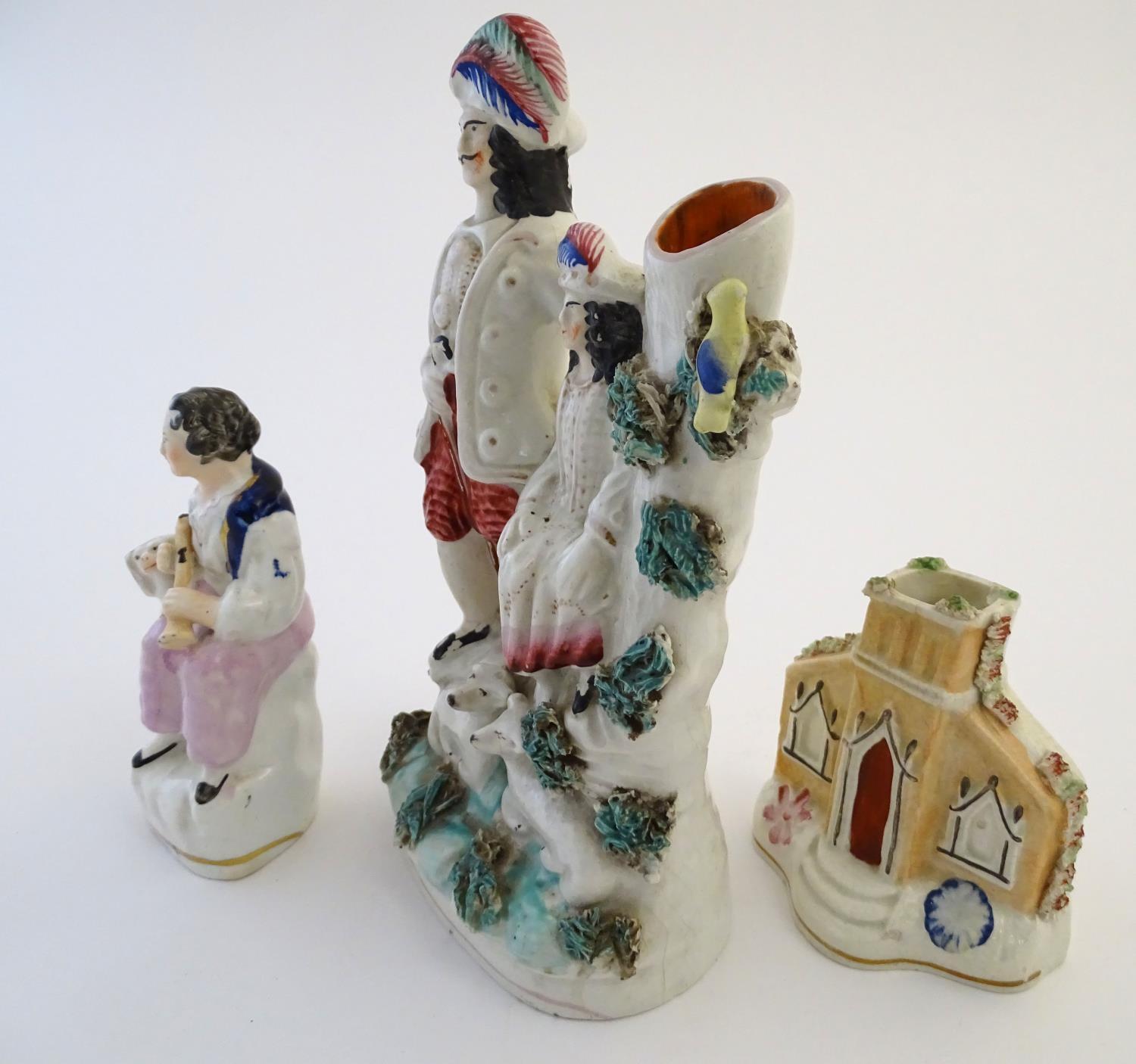 Three items of Staffordshire pottery, to include a figural bud vase, a flatback house and a figure - Image 4 of 9