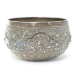 A white metal bowl with embossed figural and animal etc. decoration. Probably Indian. Approx. 3 1/2"