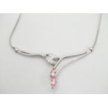 A 9ct white gold necklace set with pink and white cubic zirconia. Approx 17" long Please Note - we