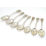A set of 7 Geo III silver fiddle pattern dessert spoons hallmarked London 1798 maker George Smith