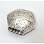 A silver pill box of hexagonal form with engraved decoration to lid. 1 1/4" wide Please Note - we do