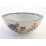 An oriental bowl decorated with landscape scenes and figures in the Imari palette. Approx. 3 1/4"