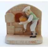 An English flatback fairing depicting a baker and his oven in relief, with caption 'Bake me a Cake'.