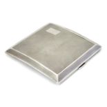 An Art Deco silver cigarette case of shaped form with engine turned decoration. Hallmarked